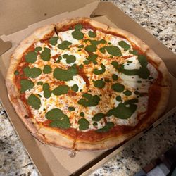 Toscanella Village Cafe - Round pesto pizza claimed to be a grandma's pie.