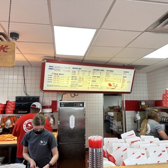 Go Chicken Go - a man standing in a restaurant kitchen - Chicken Wings Near Me - Olathe, Kansas Go Chicken Go - a man standing in a restaurant kitchen - Chicken Wings Near Me - Olathe, Kansas
