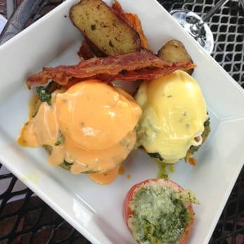 Backstreet Cafe - Benedict special with crawfish, two different hollandaise sauces, spinach, on top of artichoke hearts - New American Near Me - Houston, Texas