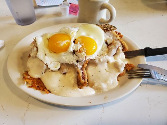 Photo of Lisa's Radial Cafe - Omaha, NE, US. The Titanic - hasbrown bed, chicken fried steak, eggs, sausage and gravy