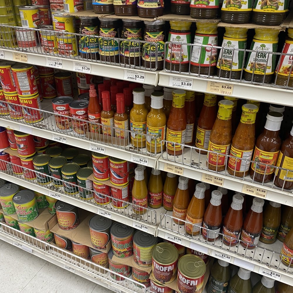Jumbo Food - a shelf of condiments in a grocery store - International Grocery Near Me - Temple Hills, Maryland
