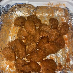 Boneless chicken wings after I put the hot sauce and ranch on.so meaty and big I had to break them in half!