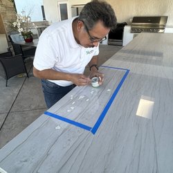 New Castle Tile Care - Removing oil stains from a quartz countertop using a stain removing poultice.
