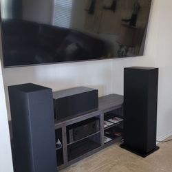 World Wide Stereo - 75inch Samsung on articulating mount, Marantz receiver, and two Bowers and Wilkins towers.