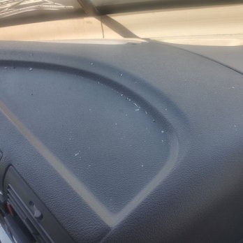 Safelite AutoGlass - After windshield replacement all the dashboard has sharp glass debris that I had to clean and I got cut in my skin - The dashboard of a vehicle shows sharp glass debris from a recent windshield replacement, with visible small glass fragments on the surface. - Auto Glass Services Near Me - Albuquerque, New Mexico