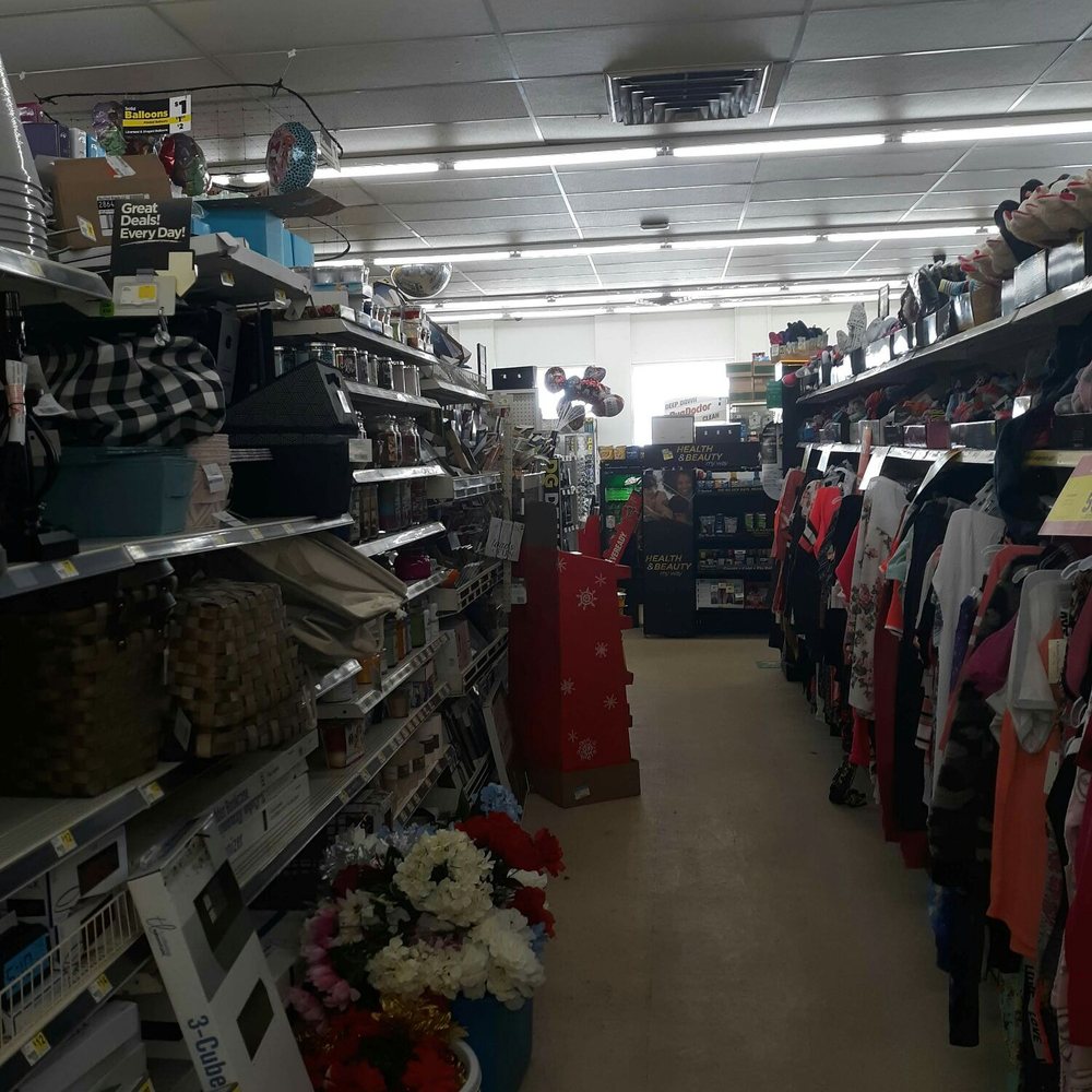 Dollar General - an aisle of clothes in a store - Grocery Near Me - Wellsville, New York