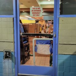 NORMS Restaurant - They keep blocking the emergency exit with chairs, vacuums, and whatever this is.
