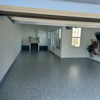 Floortek & More - a garage with a garage door open - Flooring Near Me - Highspire, Pennsylvania