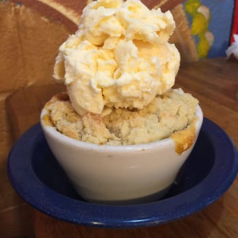 Stevie Lew's BBQ Kitchen - Yummy peach cobbler with blue bell ice cream on top! YUM - Barbeque Near Me - Rockport, Texas Stevie Lew's BBQ Kitchen - Yummy peach cobbler with blue bell ice cream on top! YUM - Barbeque Near Me - Rockport, Texas