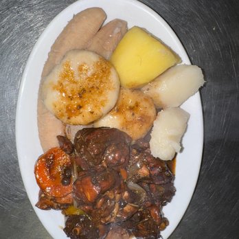 The New Blue Mountain Restaurant - Stew chicken With green bananas, yam, potatoes and boiled dumplings - Caribbean Near Me - Lauderhill, Florida The New Blue Mountain Restaurant - Stew chicken With green bananas, yam, potatoes and boiled dumplings - Caribbean Near Me - Lauderhill, Florida