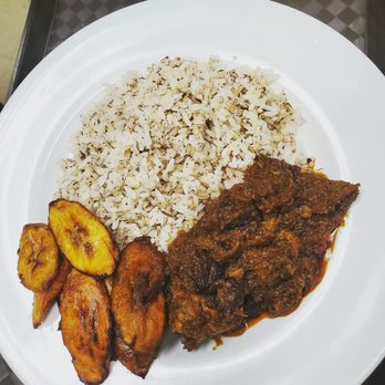 Delish Dining - a plate of food with rice and banana slices - African Near Me - Calgary, Alberta Delish Dining - a plate of food with rice and banana slices - African Near Me - Calgary, Alberta