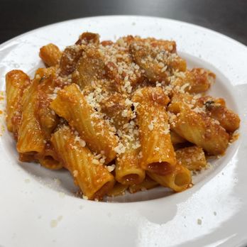 Pina's Pizza - a pasta dish on a white plate - Pizza Near Me - Miami, Florida Pina's Pizza - a pasta dish on a white plate - Pizza Near Me - Miami, Florida
