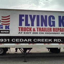 Flying K Truck & Trailer Repair - Trailer-side advertisement when you enter their facility gates.