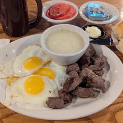 Cracker Barrel Old Country Store - Country Boy Breakfast with steak tips and eggs sunny-side up. Grits and fried okra for my 2 sides.