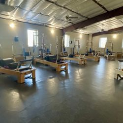Pilates Place Of the Woodlands - Reformers with towers, push through bar, and more private setting with only 8 reformers to give more attention to each individual.