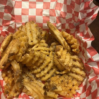 Heavenly Buffaloes - Lemon pepper Idaho waffle fries (partly eaten) - Chicken Wings Near Me - Durham, North Carolina