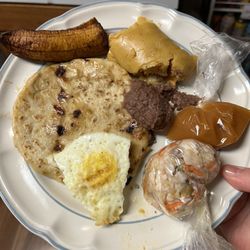 Pupuseria Usuluteca - Breakfast platter w/ pupusa, and tamale. Chefs kiss!