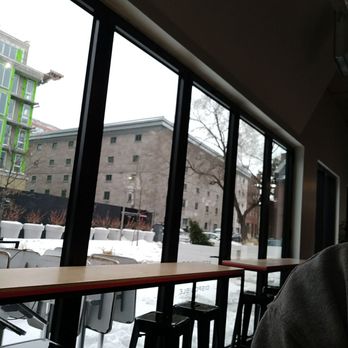 Café District - a man looking out a window - Sandwiches Near Me - Montreal, Quebec Café District - a man looking out a window - Sandwiches Near Me - Montreal, Quebec