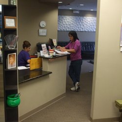 Premier Orthodontics & Dental Specialists - Elmhurst - Gabi, reigning over her kingdom, our front desk queen and office manager
