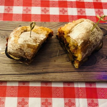 La Gastronomia - a cut in half sandwich on a cutting board - Italian Near Me - Grass Valley, California La Gastronomia - a cut in half sandwich on a cutting board - Italian Near Me - Grass Valley, California