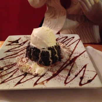 Cafe Polonia - Chocolate lava cake for dessert topped with a scope of vanilla ice cream! - Polish Near Me - Boston, Massachusetts Cafe Polonia - Chocolate lava cake for dessert topped with a scope of vanilla ice cream! - Polish Near Me - Boston, Massachusetts