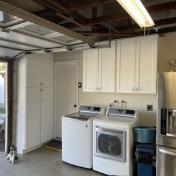 a garage with a washer and dryer