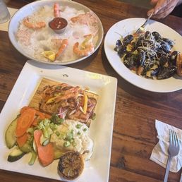 Mussels great sauce- Shrimp  loving the ice presentation- Salmon and Gato pescado and their sauce