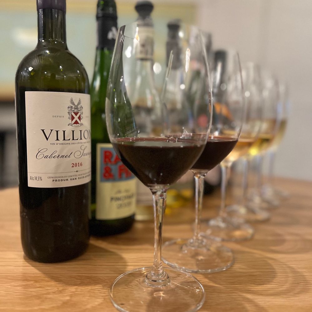 Cape Bottle Room - wine glasses and a bottle of wine - Wine Bars Near Me - Austin, Texas Cape Bottle Room - wine glasses and a bottle of wine - Wine Bars Near Me - Austin, Texas