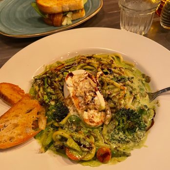 Crosby’s - Garden Pasta with sunflower seed pesto, vegetables, and burrata on top. - New American Near Me - Cedar Rapids, Iowa Crosby’s - Garden Pasta with sunflower seed pesto, vegetables, and burrata on top. - New American Near Me - Cedar Rapids, Iowa