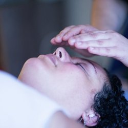 Client receiving Reiki during a private healing session