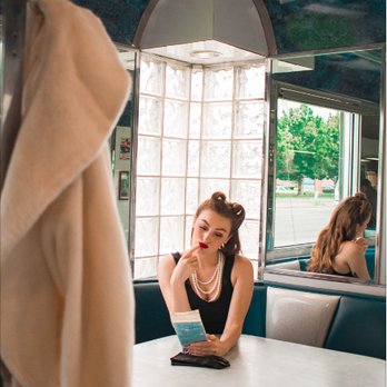Stardust Diner - Vintage/Pin-Up photoshoot with Amarantine photography at the diner. Deciding what to order. - American Near Me - Vancouver, Washington