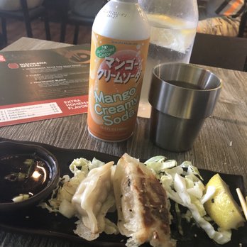 Nishikawa Ramen - Pork Gyoza dumplings. Mango cream soda. Water Carafe and water cup. - Ramen Near Me - Phoenix, Arizona