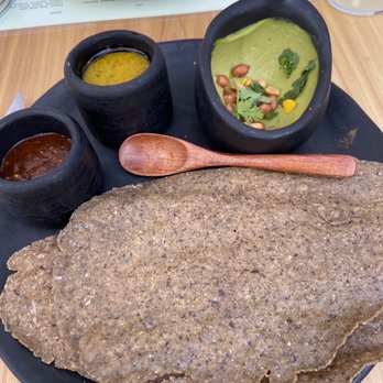 Colita - Crispy Masa Chip with guacamole, guajillo salsa and hummus (middle) - New American Near Me - Minneapolis, Minnesota Colita - Crispy Masa Chip with guacamole, guajillo salsa and hummus (middle) - New American Near Me - Minneapolis, Minnesota