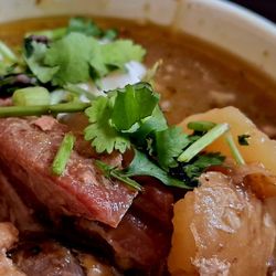 Wild Fig BBQ - Green Chili. Pork and potatoes with sour cream and cilantro added.