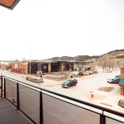 The Hotel Sturgis - View of the downtown plaza in Sturgis from the corner balcony - west on Main Street and north on Harley Davidson way