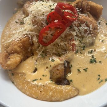Brush Park Brunch - Seafood trifecta, grilled shrimp, catfish, salmon over cheesy grits and a seafood Cajun cream sauce - Breakfast & Brunch Near Me - Detroit, Michigan Brush Park Brunch - Seafood trifecta, grilled shrimp, catfish, salmon over cheesy grits and a seafood Cajun cream sauce - Breakfast & Brunch Near Me - Detroit, Michigan