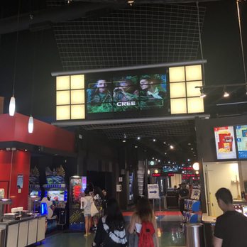 Cineplex Cinemas Yorkdale - Hallway to the theatres with a big screen above - Cinema Near Me - Toronto, Ontario