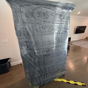 Moving & Maintenance On Demand - Fully protected china cabinet, one layer of shrink wrap, cardboard over the glass, moving blankets, and more shrink wrap. - Movers Near Me