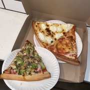 Photo of 2 Bros Pizza - New York, NY, United States. Veggie Slice (left), White Slice (middle), and Cheese Slice (right)