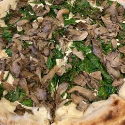 Truffle mushroom pizza loaded with lots of toppings Truffle mushroom pizza loaded with lots of toppings