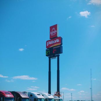 Pilot Travel Center - the high-rise shine from the highway showing the local gas prices and the Arby's - Gas Stations Near Me - Memphis, Indiana Pilot Travel Center - the high-rise shine from the highway showing the local gas prices and the Arby's - Gas Stations Near Me - Memphis, Indiana