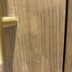 Precision Woodworking - Wood cracked and damaged from install. Spirals around handle.