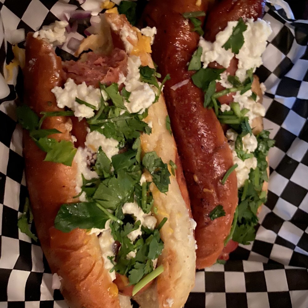 Moon Tower - Apple brandy duck dog with feta and cilantro - Dive Bars Near Me - Houston, Texas Moon Tower - Apple brandy duck dog with feta and cilantro - Dive Bars Near Me - Houston, Texas