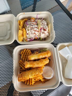 Photo of Tropical Taco - Hanalei, HI, US. two takeout containers with fish and chips