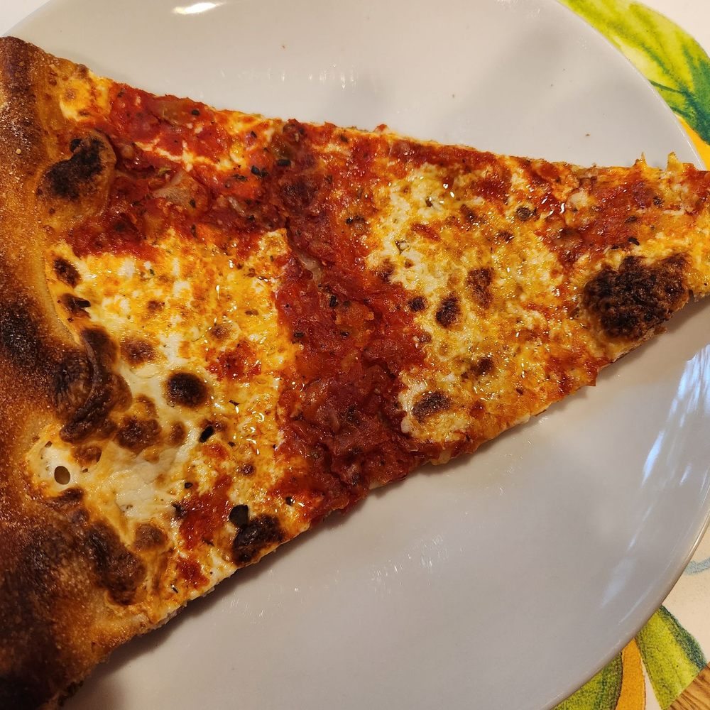 Fresh Mozzarella Pizza - This "normal" looking sized slice is actually one-half of their mega-sized slice. - Pizza Near Me - Simsbury, Connecticut Fresh Mozzarella Pizza - This "normal" looking sized slice is actually one-half of their mega-sized slice. - Pizza Near Me - Simsbury, Connecticut