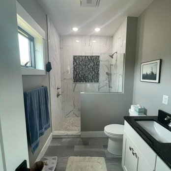 Premier Construction - a bathroom with a walk in shower - General Contractors Near Me Premier Construction - a bathroom with a walk in shower - General Contractors Near Me