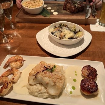 Winewood - Special with sea bass, scallops and shrimp with risotto. Miso brussel sprouts. Bone-in filet special with crab Mac and cheese. - New American Near Me - Grapevine, Texas