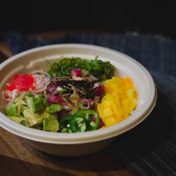 Hawaiian Poke Bowl & Pho Cafe - Build Your Own! Tuna with jalapeno & ponzu sauce, avocado, mango, masago, kani, seaweed salad, top w/ red & green onion, nori, fried shallot
