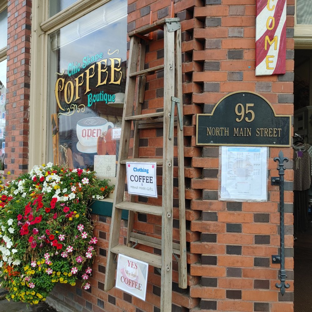 Chic Skape Coffee Boutique - a ladder leaning against a brick building - Women's Clothing Near Me - Mount Angel, Oregon