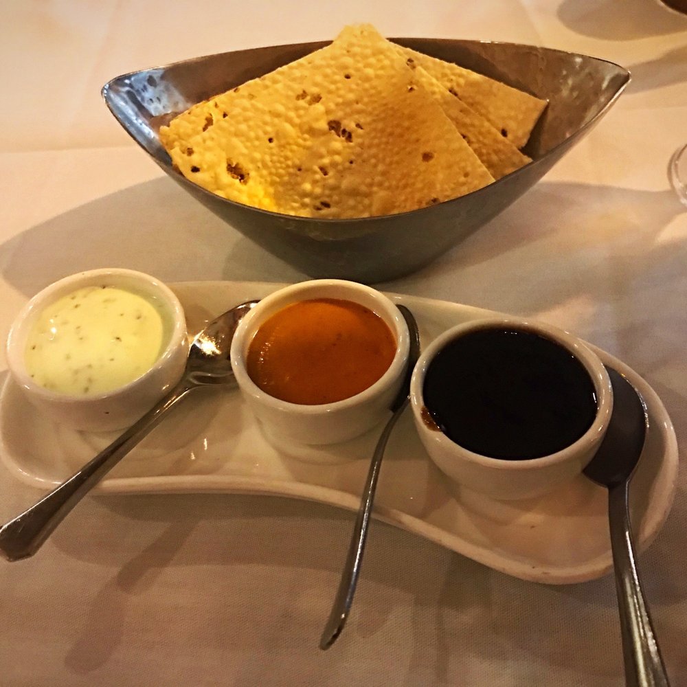 Passage to India - Papad with three sauces: raita (left), something slightly spicy (middle), tamarind (right). - Indian Near Me - Bethesda, Maryland Passage to India - Papad with three sauces: raita (left), something slightly spicy (middle), tamarind (right). - Indian Near Me - Bethesda, Maryland